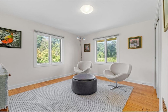 sitting room featuring light wood-style floors and baseboards