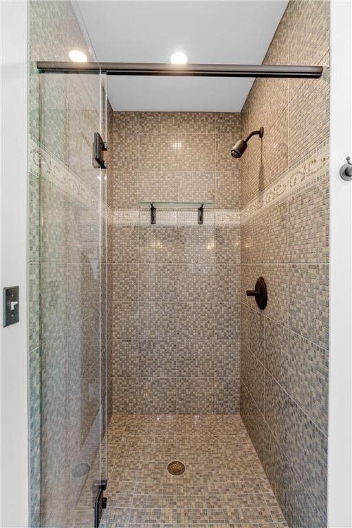 bathroom with a shower stall