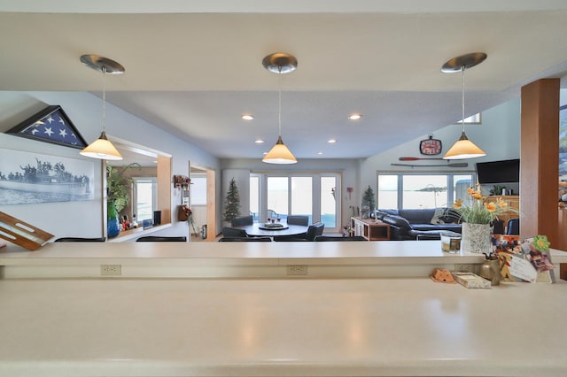 kitchen with recessed lighting, open floor plan, and decorative light fixtures