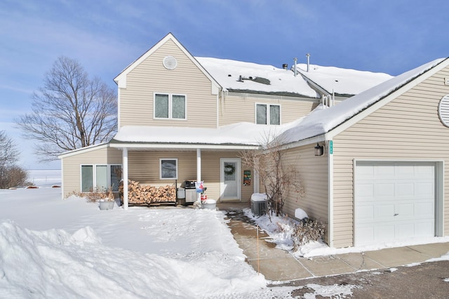 view of front of house with covered porch and an attached garage