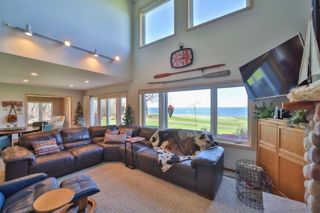 7968 Tournament Trl, Onamia, MN 56359 - living room with carpet floors, recessed lighting, and a towering ceiling