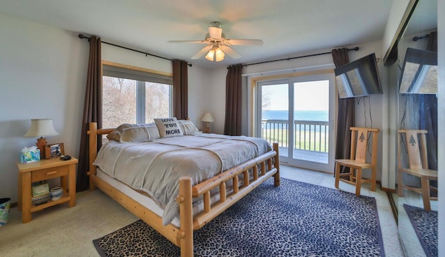 7968 Tournament Trl, Onamia, MN 56359 - carpeted bedroom with multiple windows, a ceiling fan, and access to exterior