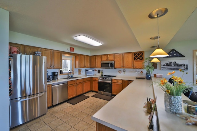 7968 Tournament Trl, Onamia, MN 56359 - kitchen with hanging light fixtures, appliances with stainless steel finishes, a sink, light countertops, and light tile patterned floors