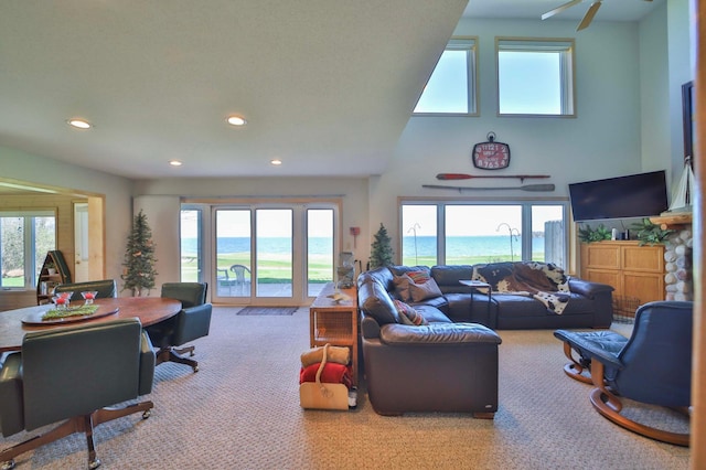7968 Tournament Trl, Onamia, MN 56359 - carpeted living room with recessed lighting and a towering ceiling