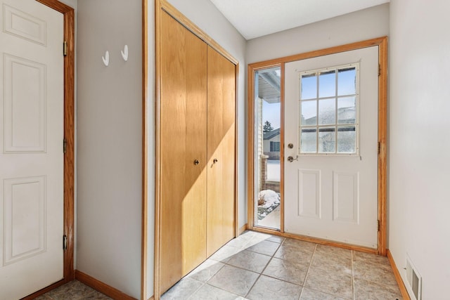 doorway featuring visible vents and baseboards