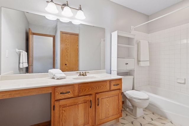 bathroom featuring washtub / shower combination, toilet, and vanity