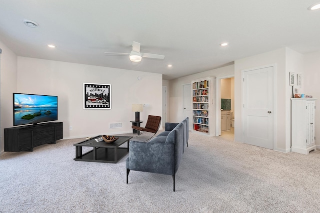 carpeted living room with recessed lighting, visible vents, ceiling fan, and baseboards