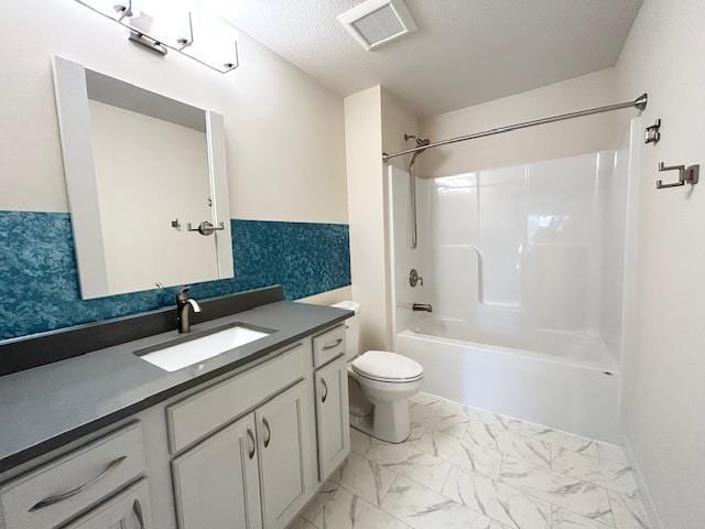 full bathroom featuring visible vents, bathing tub / shower combination, toilet, marble finish floor, and vanity