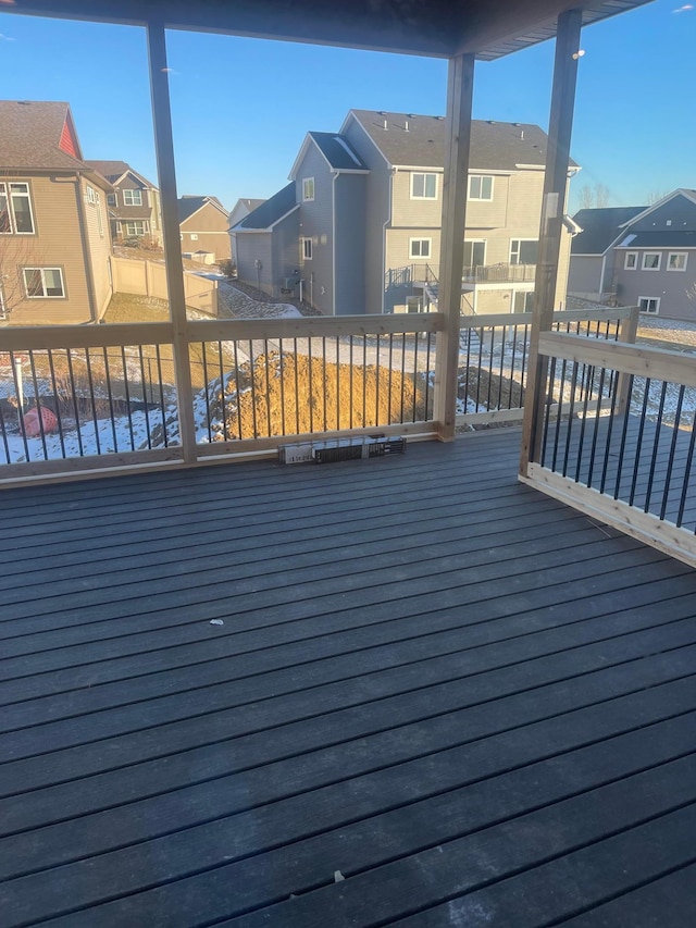 wooden terrace featuring a residential view