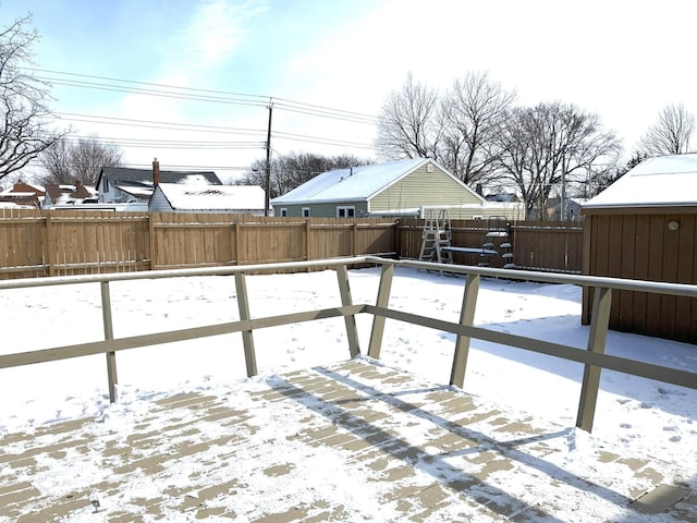 view of yard layered in snow