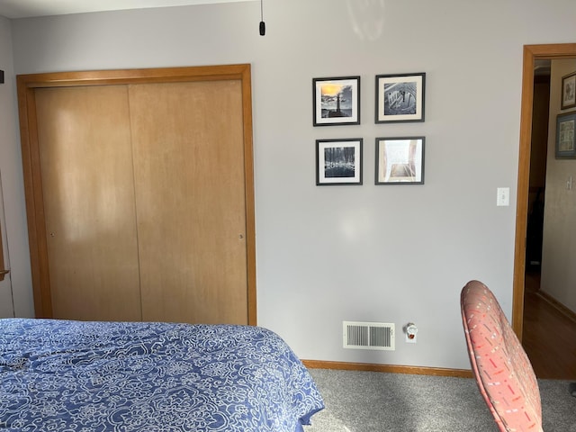 bedroom featuring carpet and a closet