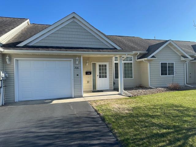 706 33rd St NW, Bemidji, MN 56601 - single story home featuring a garage, asphalt driveway, a front yard, and a shingled roof