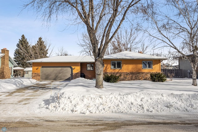 single story home featuring a garage