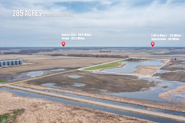 drone / aerial view with a water view and a rural view