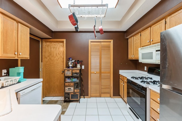 2752 Autumnwood Ln, Minnetonka, MN 55305 - kitchen with white appliances, light countertops, and light tile patterned flooring