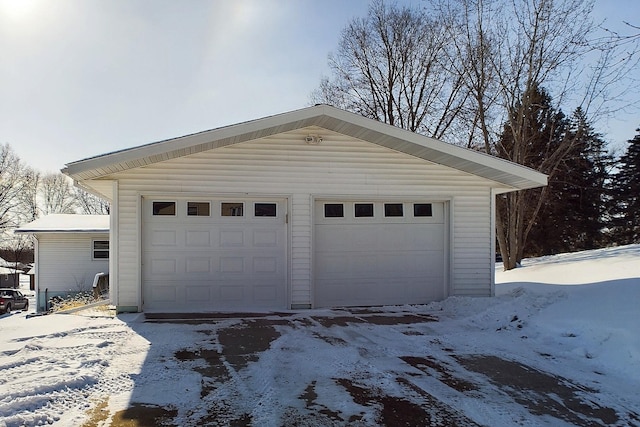 view of snow covered garage