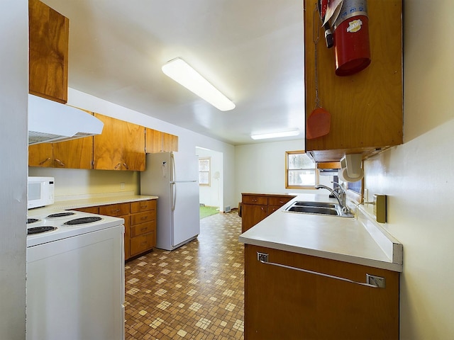 kitchen with sink and white appliances