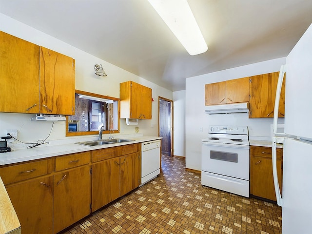 kitchen featuring white appliances and sink