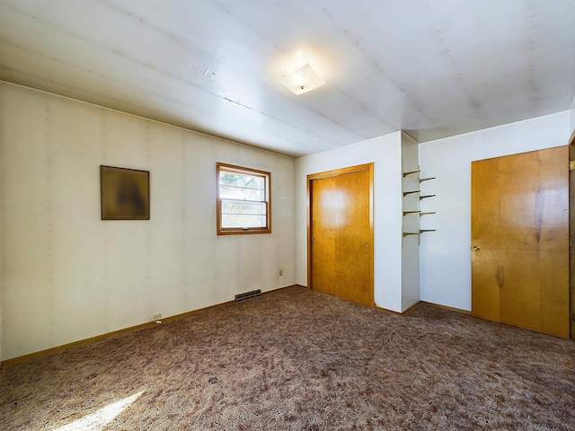 unfurnished bedroom with carpet and a closet