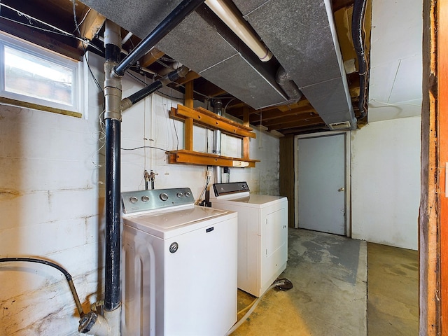 washroom with washing machine and clothes dryer