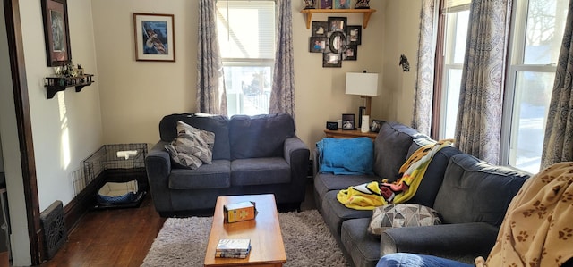 sitting room with a healthy amount of sunlight and dark hardwood / wood-style floors