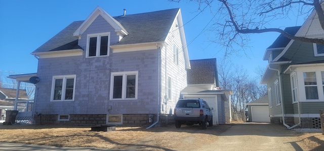 view of home's exterior featuring roof with shingles