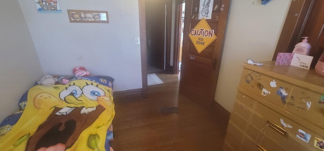 bedroom featuring wood finished floors