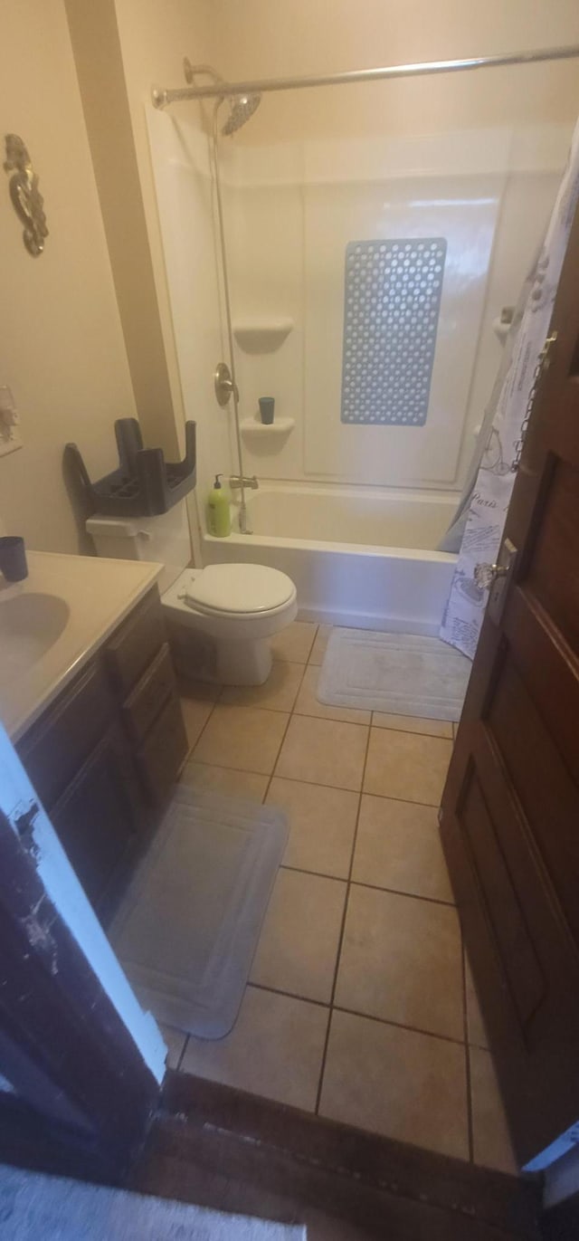 bathroom featuring toilet, shower / bath combination with curtain, tile patterned flooring, and vanity