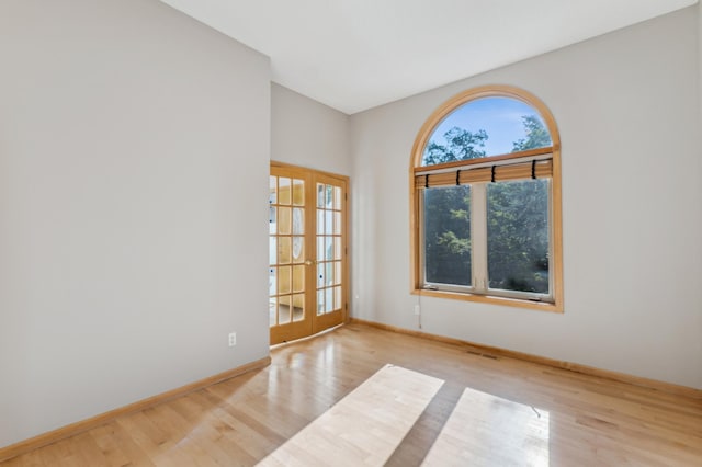 unfurnished room with light hardwood / wood-style flooring