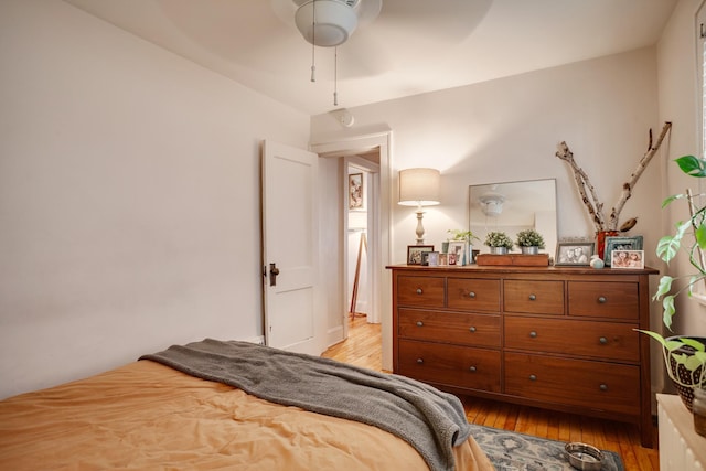 bedroom featuring light wood-style flooring and ceiling fan