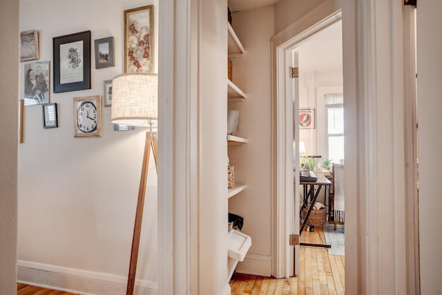 corridor with light wood-style floors