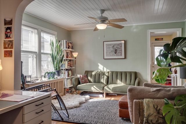 interior space featuring a wealth of natural light, light wood-type flooring, and ornamental molding