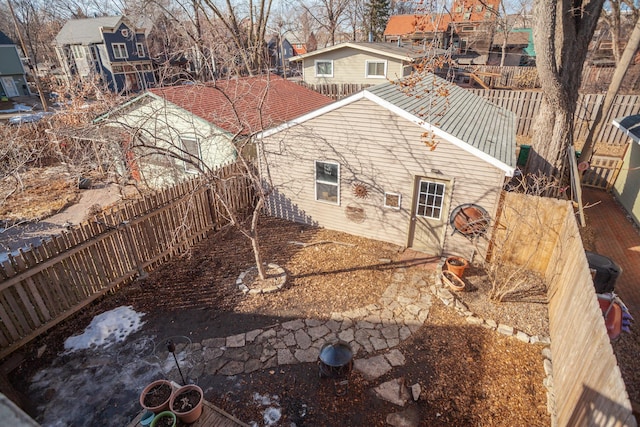 rear view of property with a residential view and a fenced backyard