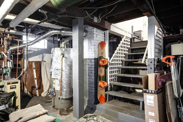 unfinished basement featuring stairway, a heating unit, and water heater