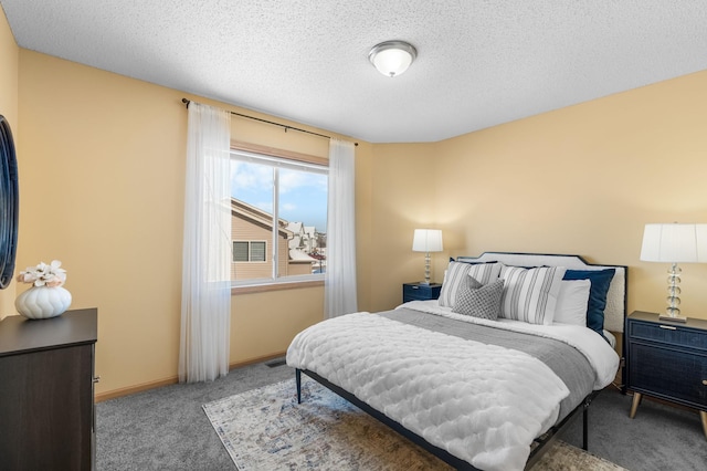 bedroom with carpet flooring and a textured ceiling