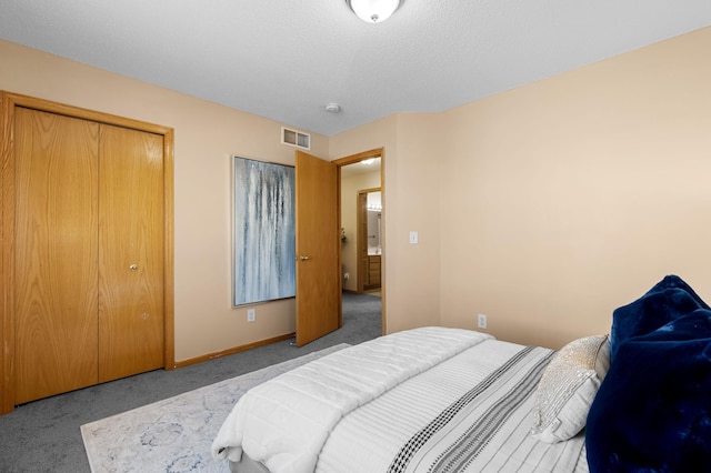 carpeted bedroom featuring a closet