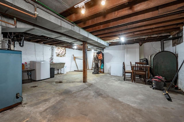 basement featuring fridge