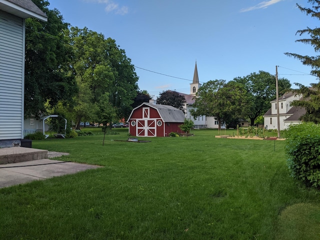 view of yard with a barn and an outdoor structure