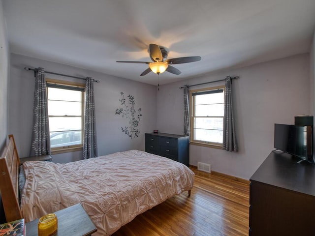 bedroom featuring hardwood / wood-style flooring and ceiling fan