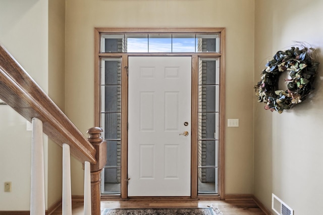 entrance foyer with hardwood / wood-style floors