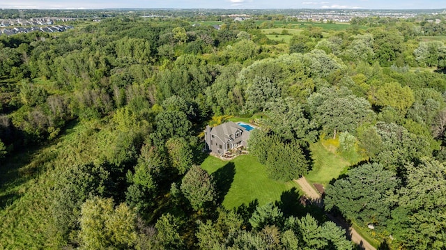 drone / aerial view with a view of trees