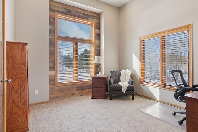 home office with a healthy amount of sunlight, baseboards, and carpet