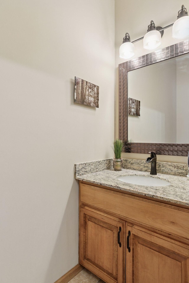 bathroom featuring vanity and baseboards