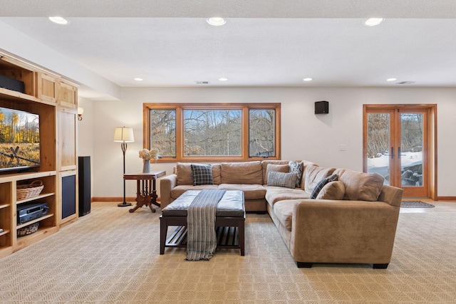 living room with recessed lighting, baseboards, light carpet, and visible vents