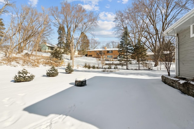 view of yard layered in snow