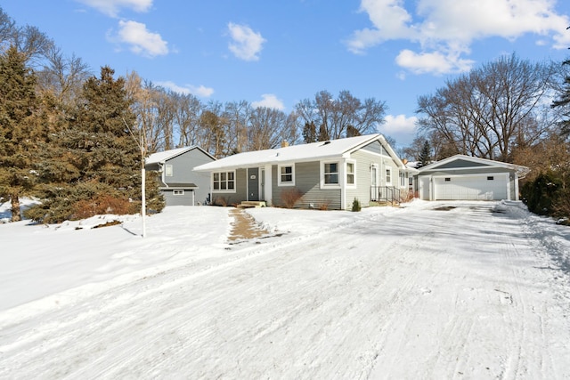 view of front facade featuring an outbuilding and a garage