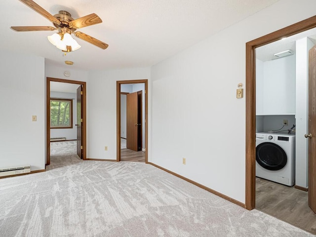 unfurnished room featuring light carpet, washer / dryer, and ceiling fan