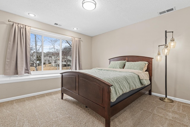 bedroom featuring carpet flooring, visible vents, and baseboards