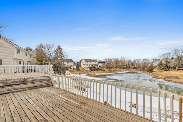 deck with a water view and a residential view