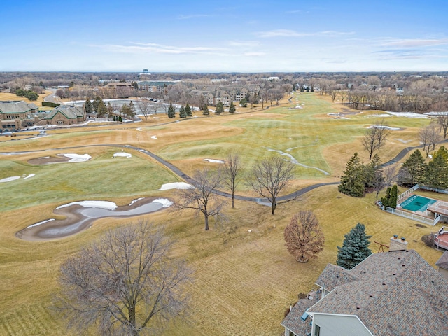 bird's eye view with view of golf course